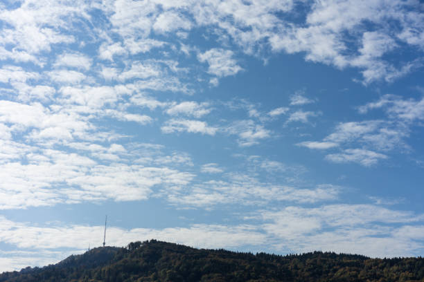 mountain with tv tower and cloudy blu sky in summer