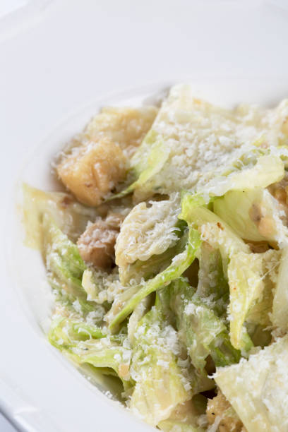 istock caesar salad with chicken breast and parmesan cheese 877781128