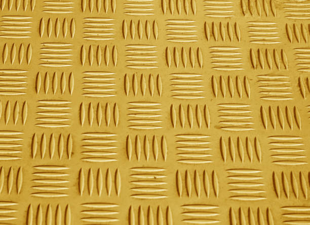 istock Orange color metal floor pattern with blur effect. 877799722