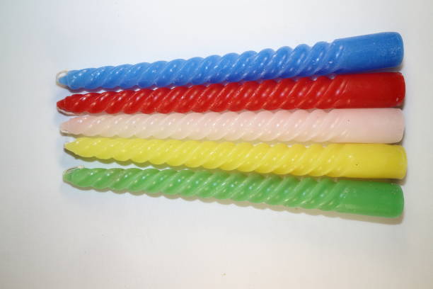 istock colored candles for the New Year holiday 877807382