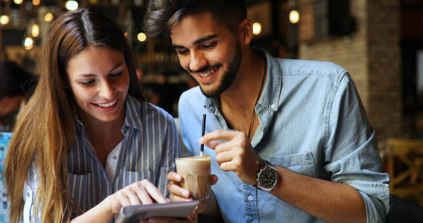 istock Woman and man flirting in cafe 877811814