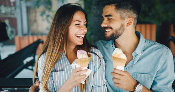 istock Happy couple having date and eating ice cream 877811834