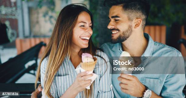 Happy Couple Having Date And Eating Ice Cream Stock Photo - Download Image Now - Ice Cream, Eating, Couple - Relationship