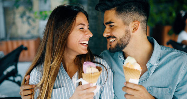 istock Happy couple having date and eating ice cream 877811874