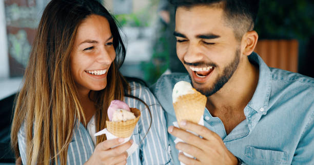istock Happy couple having date and eating ice cream 877811892