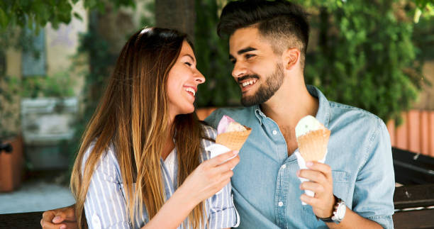 istock Happy couple having date and eating ice cream 877812654