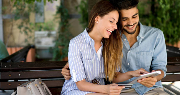 istock Happy couple doing shopping on internet 877820232