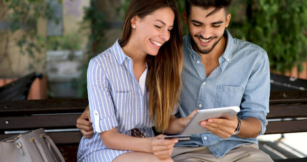 istock Happy couple doing shopping on internet 877822326