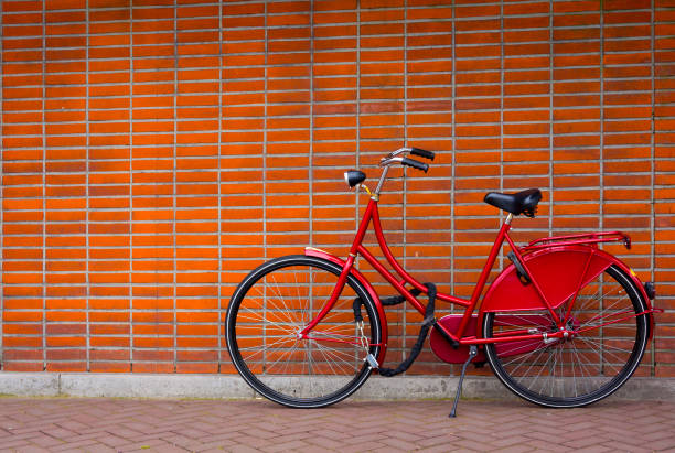 istock Traditional dutch bicycle parked on near brick wall in Amsterdam 877825482