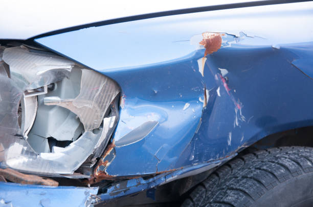 istock Broken headlight in car crash accident on damaged car with dented sheet selective focus 877825968