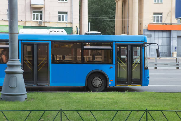 istock bus goes along street 877826772