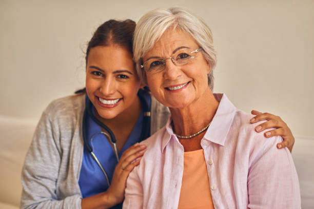 istock Senior female patient with nurse 877829168