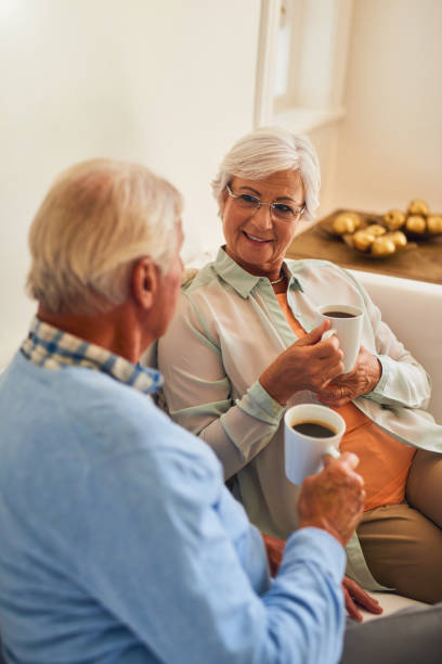 istock Senior couple at home together having funny conversation 877837036