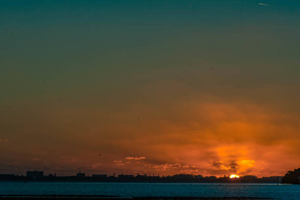 Sunset in the Bay Sarasota Bay sunset looking at Longboat Key longboat key stock pictures, royalty-free photos & images