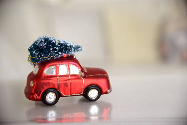 istock New Year Christmas presents red car Christmas tree 877846312