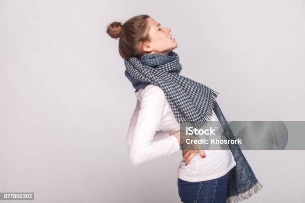 Profile View Sick Woman Which Hurts The Back Or Kidneys Stock Photo - Download Image Now