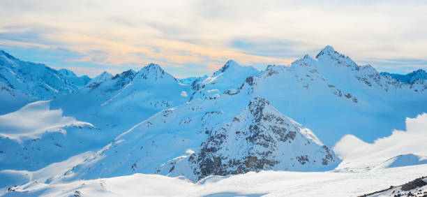 istock Panorama with range of mountains peaks 877854032