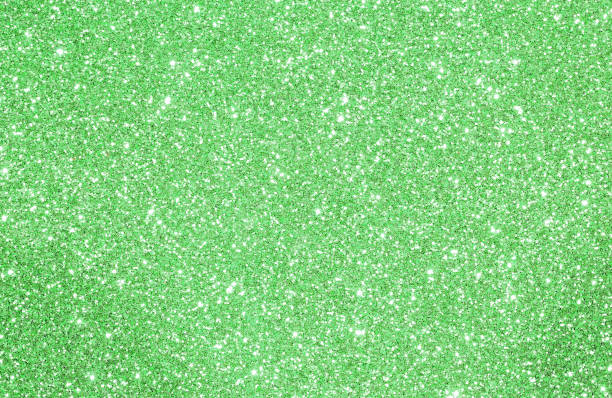 istock Green glittered background with glittering lights and reflection 877854742