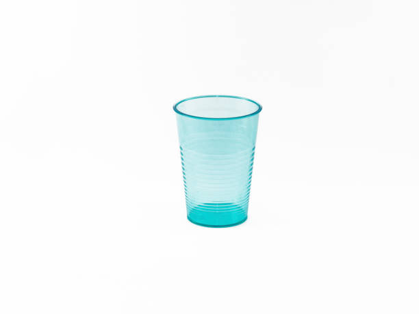 istock Blue plastic glass isolated on white background 877861522