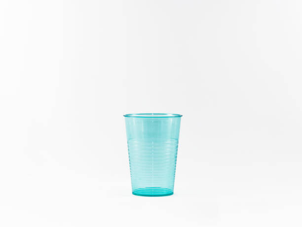 istock Blue plastic glass isolated on white background 877861548
