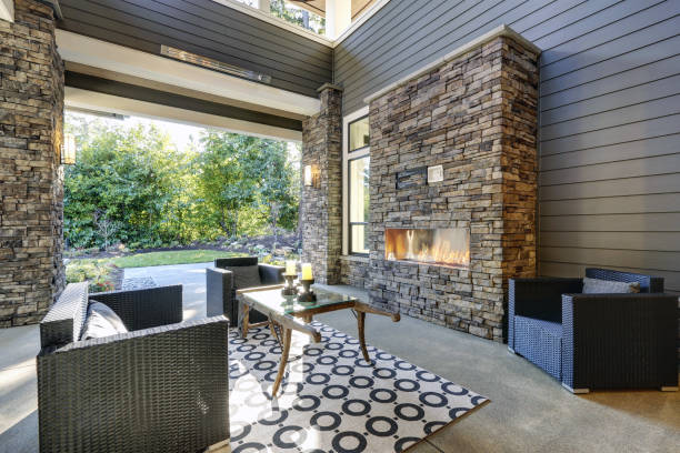 istock Well designed covered patio boasts stone fireplace 877873246