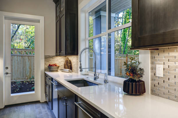 istock Contemporary kitchen design with brown kitchen cabinets 877873628