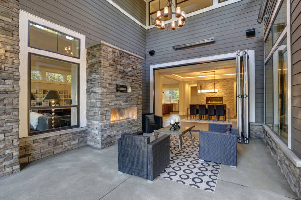 istock Well designed covered patio boasts stone fireplace 877874024