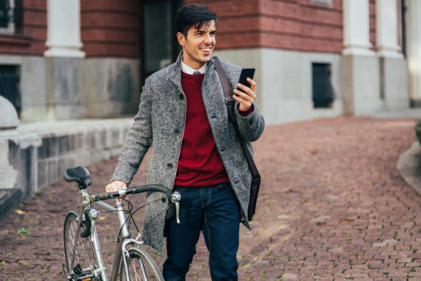 istock Bicyclist texing in the city 877874146