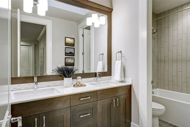 istock White and brown bathroom boasts a nook filled with double vanity 877877788