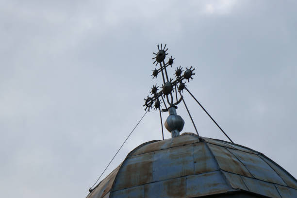 istock Iron cross on church 877880896