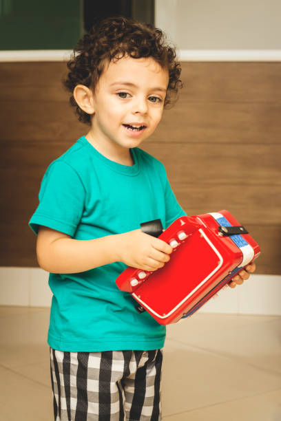 istock Cute musician boy 877881508