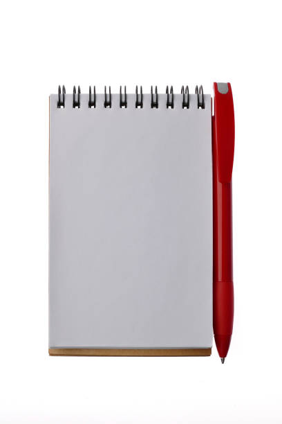 istock Note and red ballpoint pen - isolated on white background 877886800