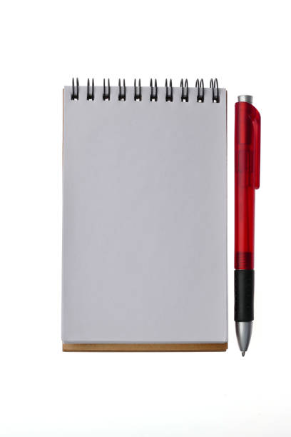istock Note and red ballpoint pen - isolated on white background 877886840
