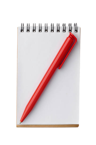 istock Note and red ballpoint pen - isolated on white background 877886998