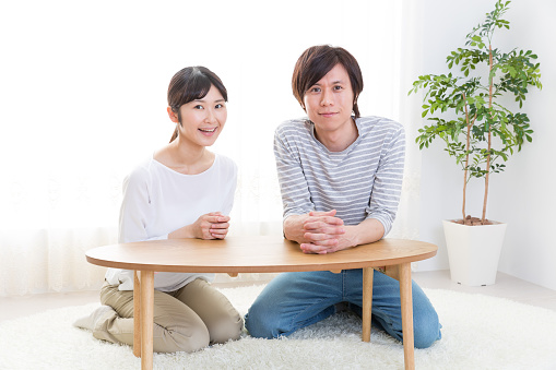 portrait of young asian couple relaxing