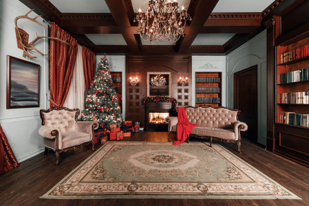 istock Christmas evening. classic apartments with a white fireplace, decorated tree, sofa, large windows and chandelier. 877896556