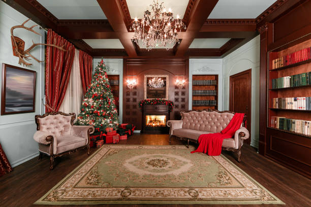 istock Christmas evening. classic apartments with a white fireplace, decorated tree, sofa, large windows and chandelier. 877898862