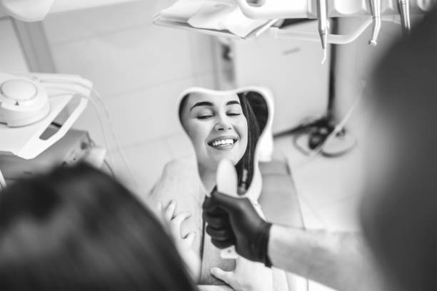 Dentist examining patient