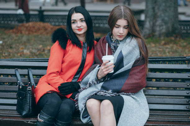 istock Girls on the bench 877912794