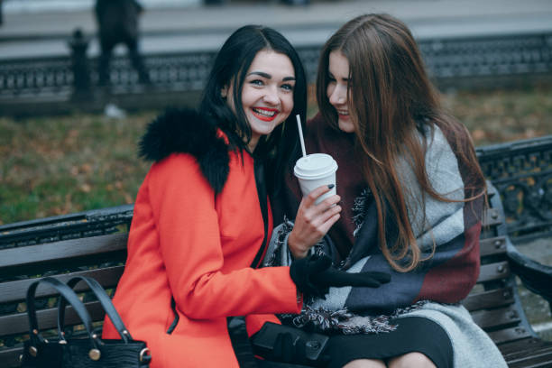 istock Girls on the bench 877912814