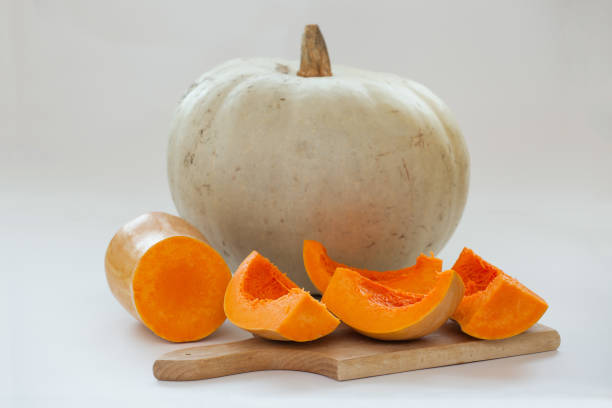 muscat pumpkin on a cutting board stock photo