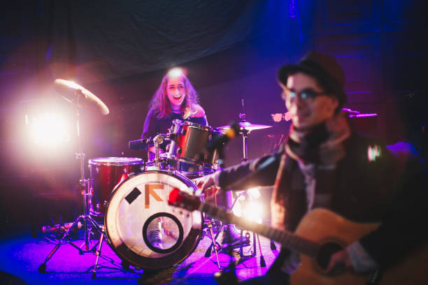 istock Young man and woman playing  music 877923540
