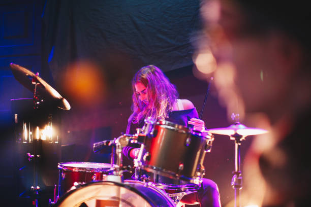 istock Female drummer playing in the club 877939292
