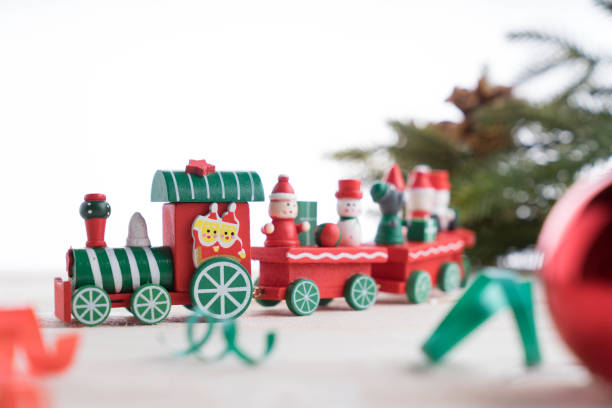 istock toy train on wooden background for christmas 877959548