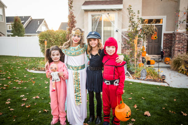 istock Group of Kids Trick or Treating on Halloween 877963448