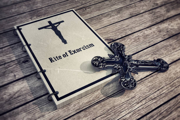 Rite of exorcism 3d Illustration of an exorcism book on wooden floor exorcism stock pictures, royalty-free photos & images