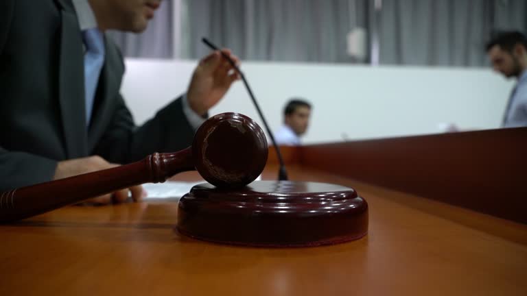 Judge at the courtroom reading the sentence to the offender