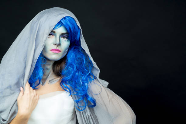 istock Makeup. Image of a witch in a bride dress 877997826