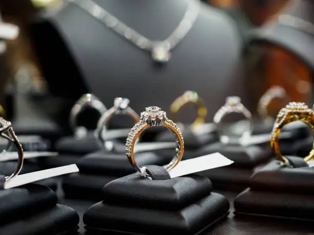 Photo of Jewelry diamond rings and necklaces show in luxury retail store window display
