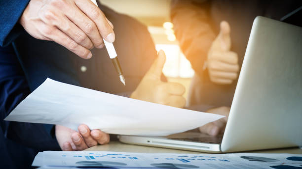 istock Cropped Hands Of People Working On Chart 878003550